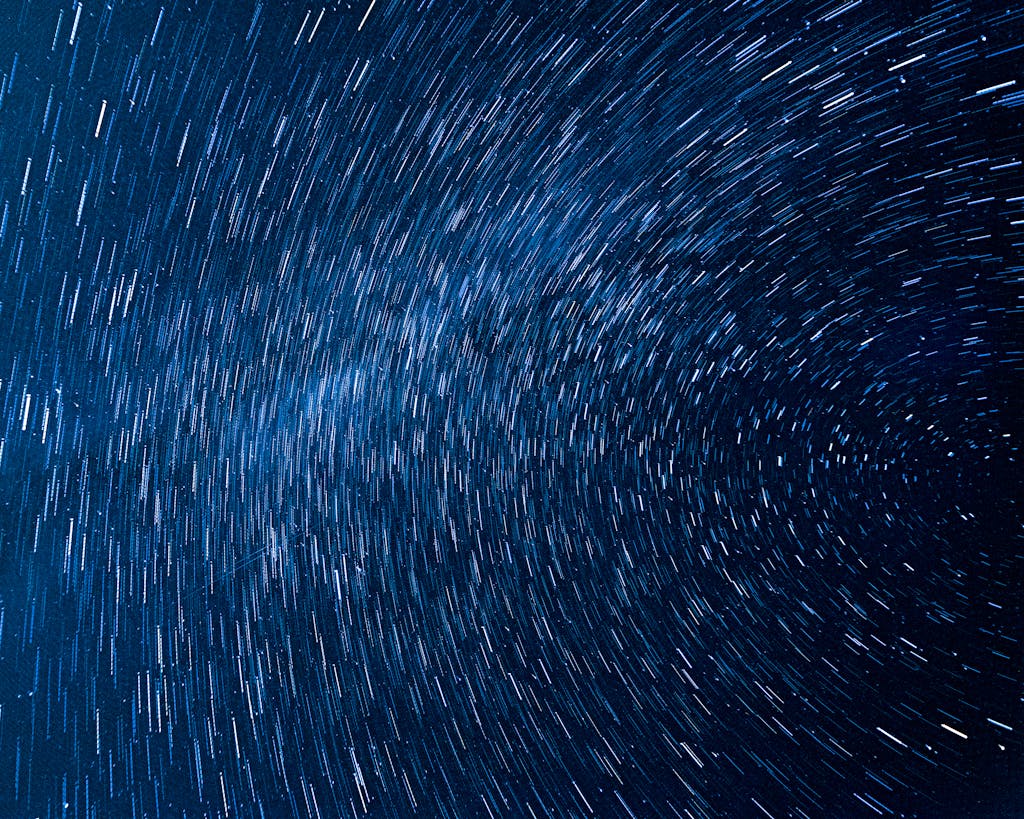 Captivating view of rotating star trails in a clear night sky, captured from Pont-a-Celles, Belgium.
